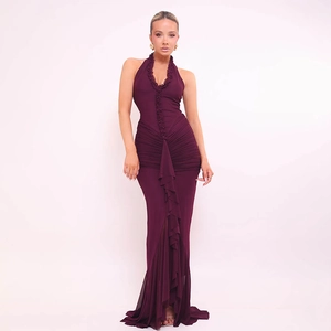 Detail view of the deep purple halter neck dress with ruffled hem and sexy front slit
