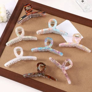 7-piece set of large acetate hair claws with striped marble patterns and tortoiseshell designs