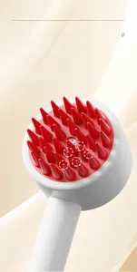 Close-up of mouse-shaped pet bath brush with red silicone bristles and air cushion