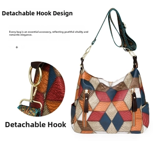 Detail of detachable gold hook and textured crossbody bag with colorful patchwork pattern