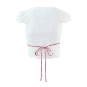 Women's white crop top featuring floral hollow embroidery and red gingham waist tie