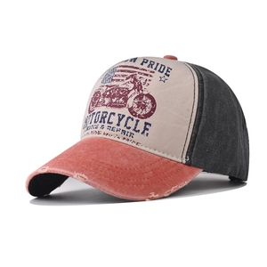Detail of vintage washed cotton baseball cap with retro motorcycle print and distressed brim