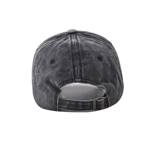 Detail view of cotton baseball cap with adjustable metal buckle and washed fabric texture