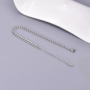 Minimalist silver stainless steel curb chain bracelet with adjustable lobster clasp closure