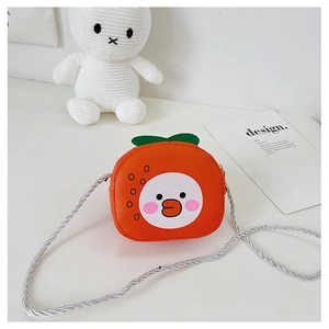 Close-up of cute orange-shaped kids crossbody bag with duck print and braided strap