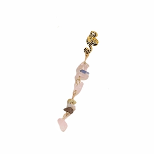 Detail of a golden snake ear clip with pink and green natural stone pendant droplets