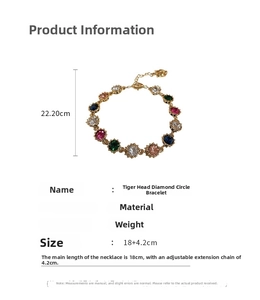 Detail view of colorful rhinestone circle bracelet with tiger head and lobster clasp