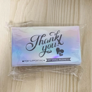 Macro view of holographic Thank You cards for small business in clear plastic packaging