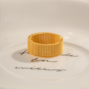 Minimalist 8mm wide 18K gold-plated stainless steel mesh textured ring on white plate