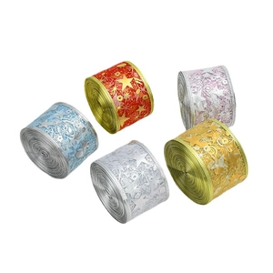 Glittery Christmas sheer ribbons with gold stars and notes in five festive colors