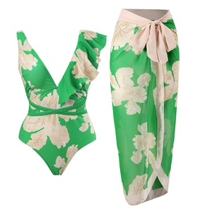 Detail of green floral bikini set with ruffle shoulder and matching bow sarong wrap
