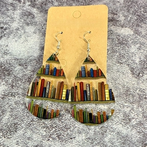 Teardrop acrylic earrings featuring classic bookshelf pattern on brown jewelry card