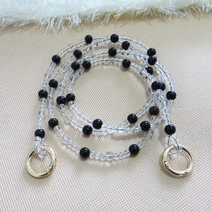 Detail view of crystal beaded purse strap with gold spring clasps for bag modification