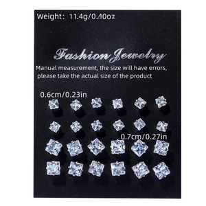 Detailed view of 12 pairs of square-cut cubic zirconia stud earrings on a display card
