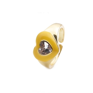 Detailed view of golden open ring featuring a yellow heart enamel and white zircon stone