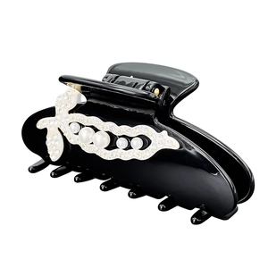Elegant black acetate hair claw clip with pea pod design featuring pearls and rhinestones