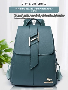 Detail of dark teal pebble leather backpack featuring gold metal clasp and kangaroo logo