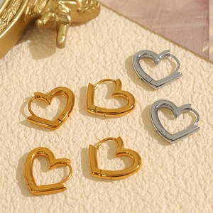 Minimalist heart-shaped hoop earrings in polished gold and silver finishes