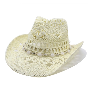 Hollow straw cowboy hat with wide brim and white heart bead band for summer sun protection
