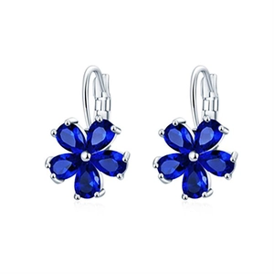 Elegant silver flower earrings with pear-cut blue petals and central crystal on white background