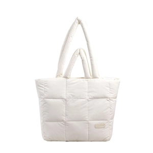 White quilted puffer tote bag with fashion leather patch and dual handles for travel