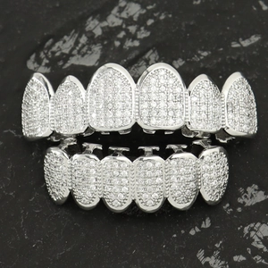 Macro shot of silver hiphop grillz set with pavé micro-inlaid sparkling zircons