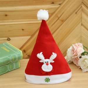 Classic red Christmas hat with plush reindeer design and snowflake sequins on wood table