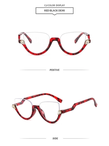 Detail of red black demi cat-eye frames with rhinestones and unique wavy temples