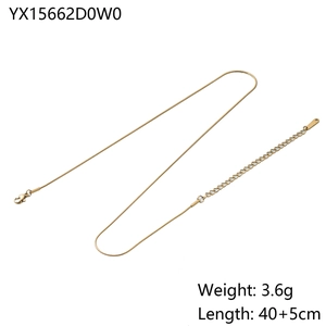 Detailed view of golden snake bone necklace with lobster clasp and adjustable extension chain