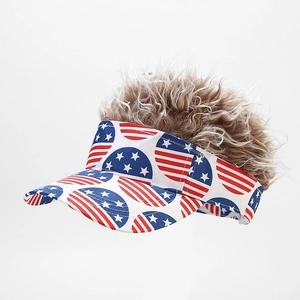 Detail of baseball hat with USA flag pattern and attached brown curly synthetic wig hair