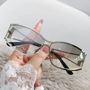 Y2K futuristic silver metal sunglasses with grey gradient lenses for street style