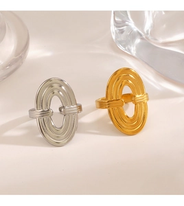 Close-up of geometric oval rings in silver and 18K gold plating with hollow design