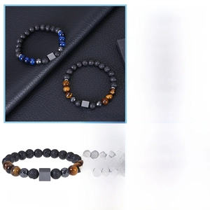 Macro detail of natural tiger eye and black magnetic stone yoga healing bracelet