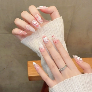 Faux ongles faits main en forme d'amande avec relief cygne 3D, perles et nœuds