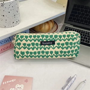 Close-up of vintage tulip floral pencil case with canvas texture in desk setting