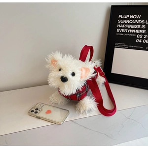 Close-up of white plush puppy bag with red plaid vest and wide shoulder strap
