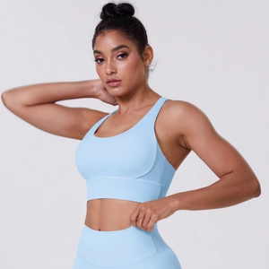 Detail of light blue sports bra showing high-elasticity fabric and wide supportive band