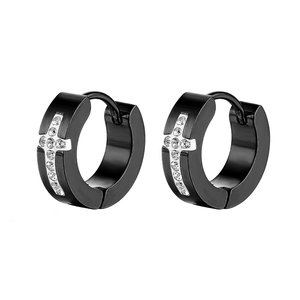 Close-up of black cross huggie earrings with silver cross inlay and white rhinestones