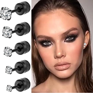 Detail of five pairs of black stud earrings with clear cubic zirconia in various sizes
