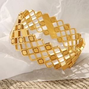 Elegant gold-plated titanium steel hollow geometric cuff bracelet with polished finish