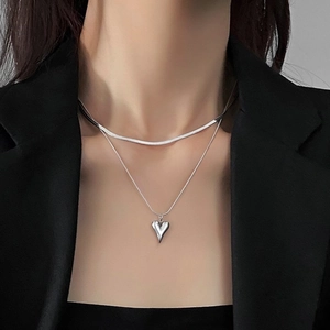 Minimalist silver double layer necklace featuring snake chain and chic heart pendant