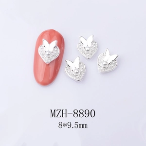 Detail view of 8x9.5mm alloy heart and butterfly nail art charm with white pearls