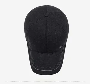 Top view of dark grey winter baseball cap with thick wool texture and silver wing emblem
