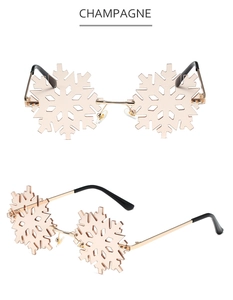 Detail view of champagne snowflake-shaped rimless sunglasses from front and side angles