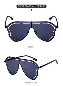 Detail view of sand black oversized shield sunglasses with all gray lenses front and side