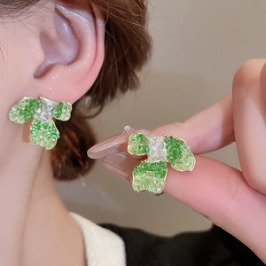 Elegant gold-plated butterfly flower stud earrings with green crystals and zircon stones