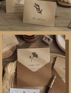 Vintage floral greeting card set with kraft envelope on a cozy wooden desk setup
