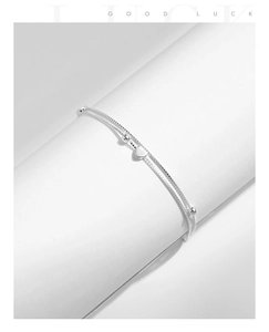 Detail of S925 sterling silver double-layer bracelet with heart charm and beads