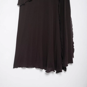 Dark brown knit midi skirt with irregular hem and delicate ruffle edge detail