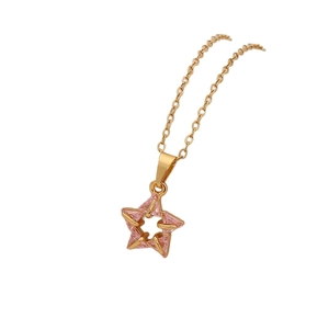 Gold stainless steel star pendant necklace featuring pink cubic zirconia on white backdrop